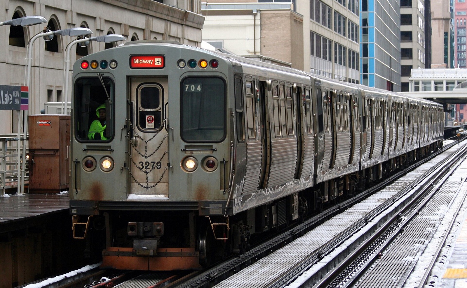 Orange Line L train at an elevated Loop station after light snow